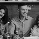 Smiling family enjoying quality time together at dining table in cozy kitchen.